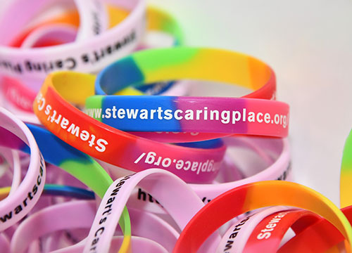 a collection of Stewart's Caring Place bracelets