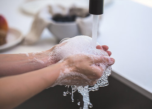 person washing their hands
